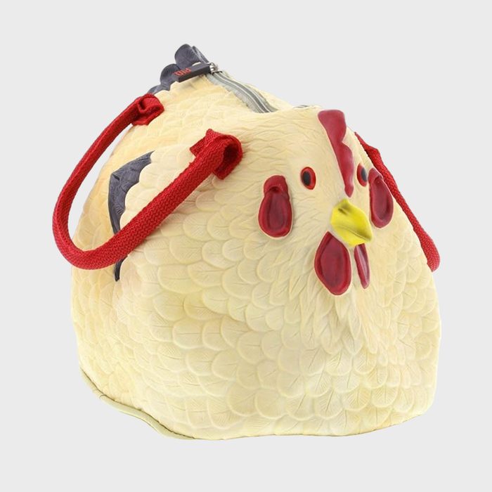 Chicken-shaped handbag, featuring red handles and a zipper, set against a neutral backdrop.