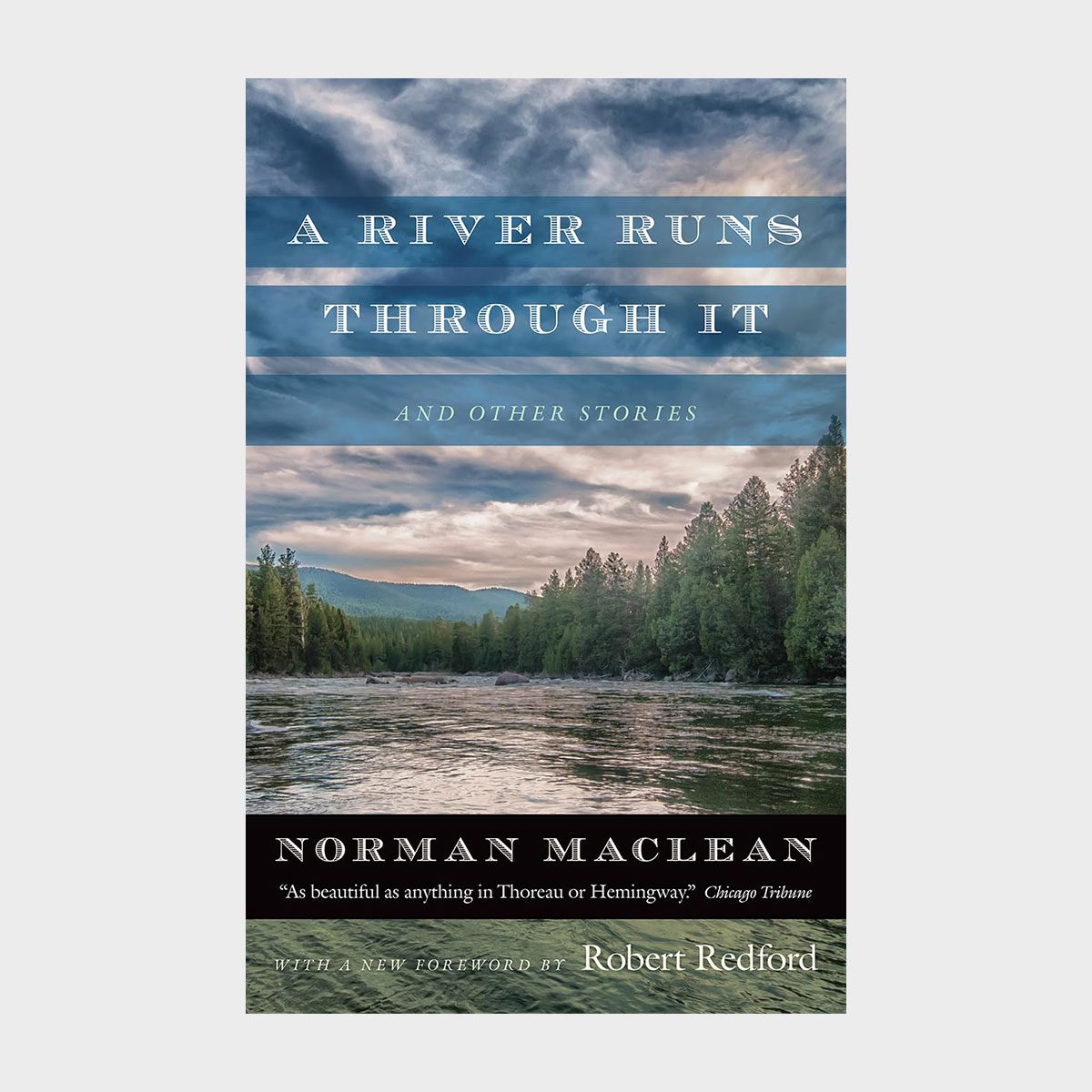 Book cover with a river flowing through a forest under a cloudy sky. Text: "A River Runs Through It and Other Stories" by Norman Maclean.
