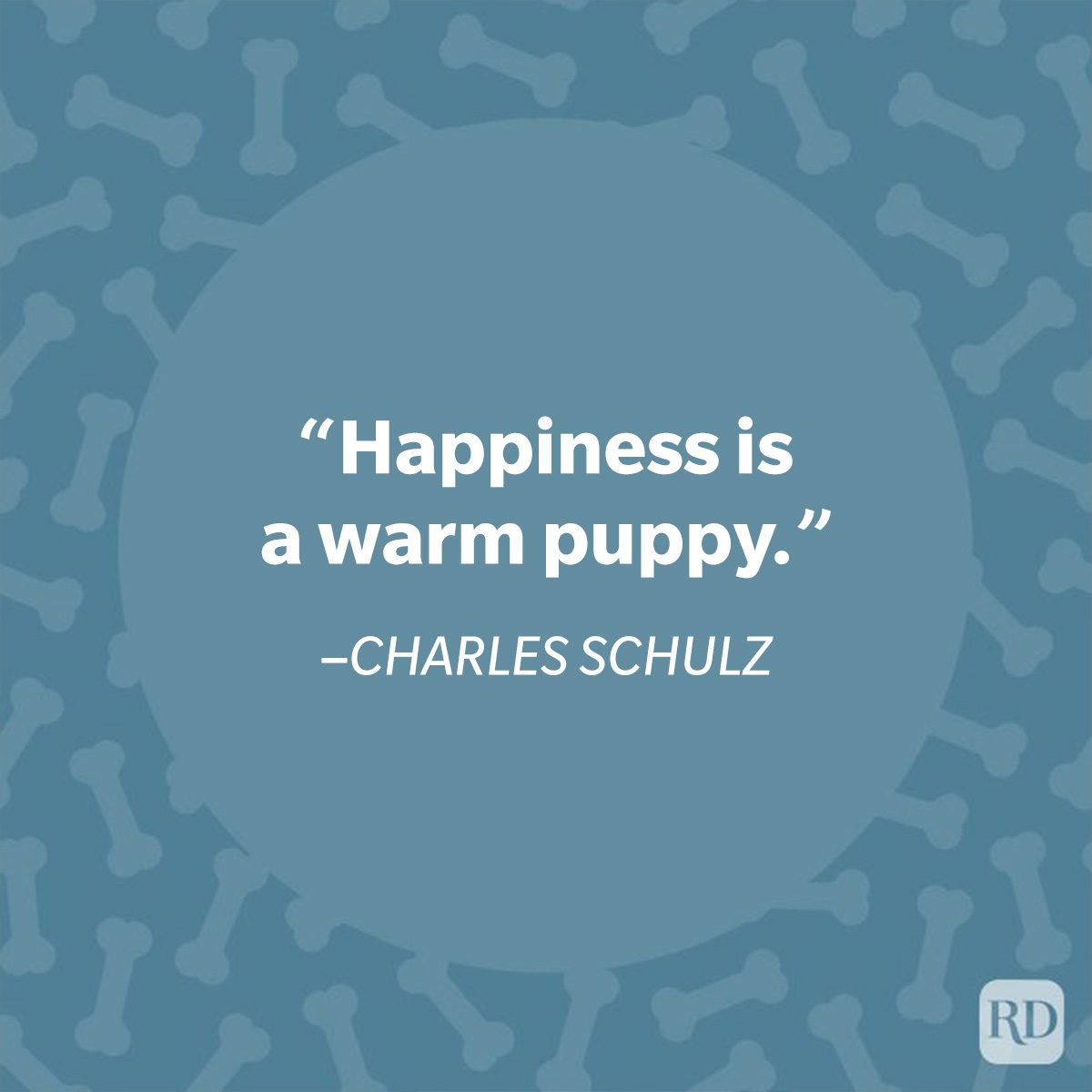 Quote reads, "Happiness is a warm puppy." by Charles Schulz. Background features a pattern of dog bones on a blue design.