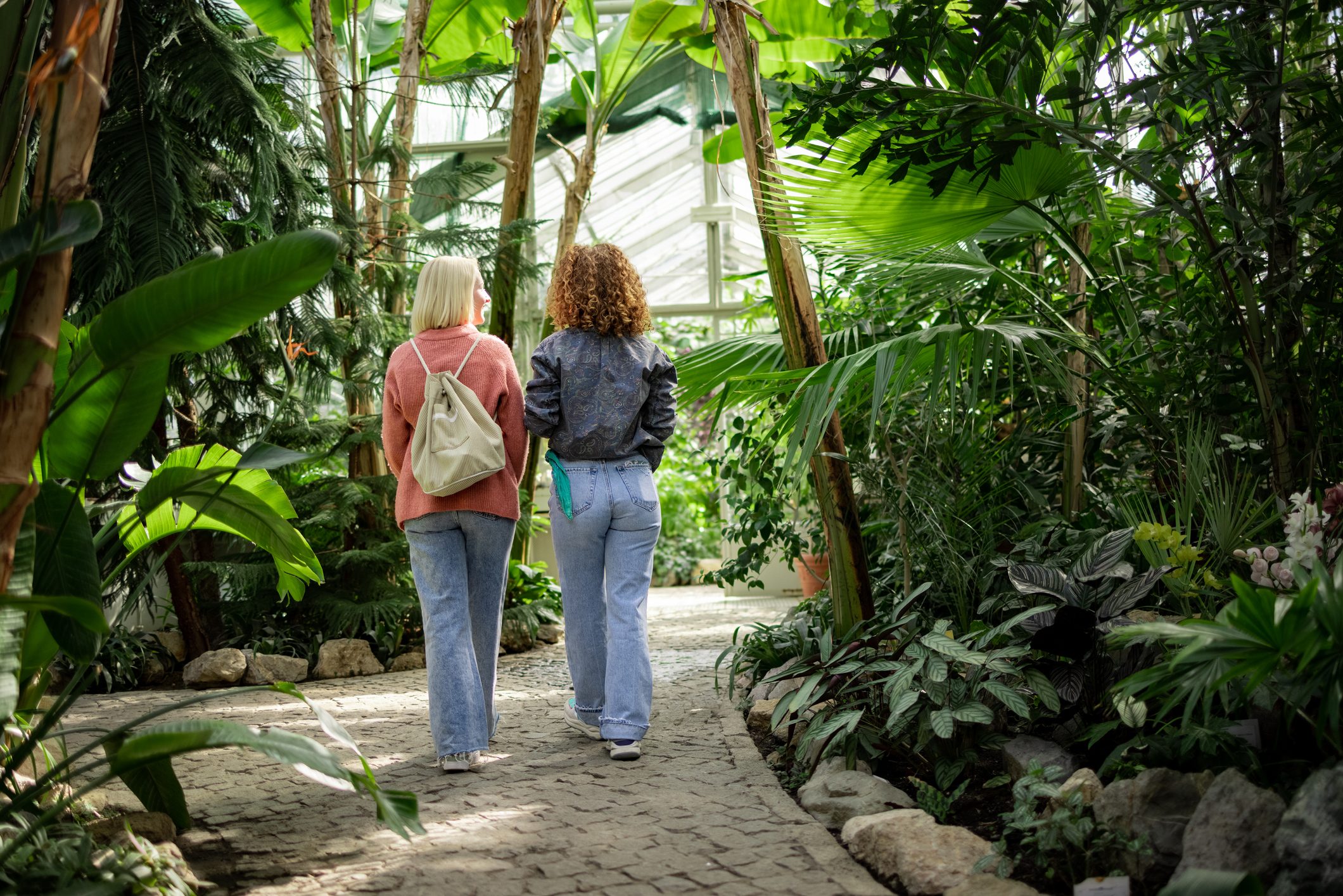 Rear view of young Caucasian women visiting their local botanical garden