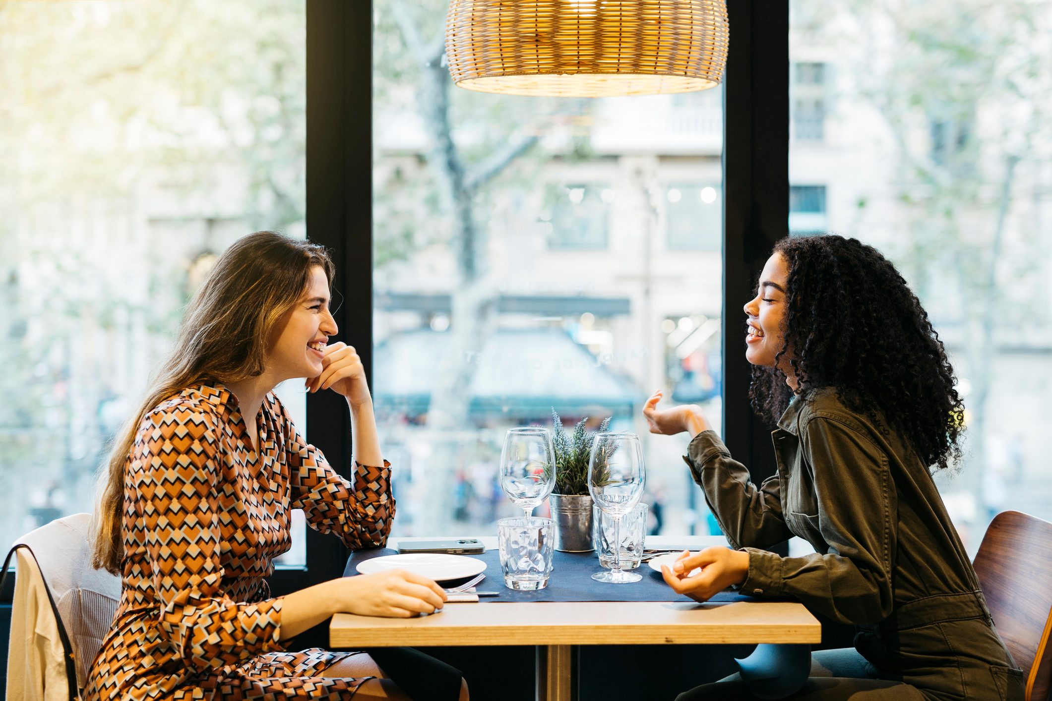 Two women sitting on a restaurant