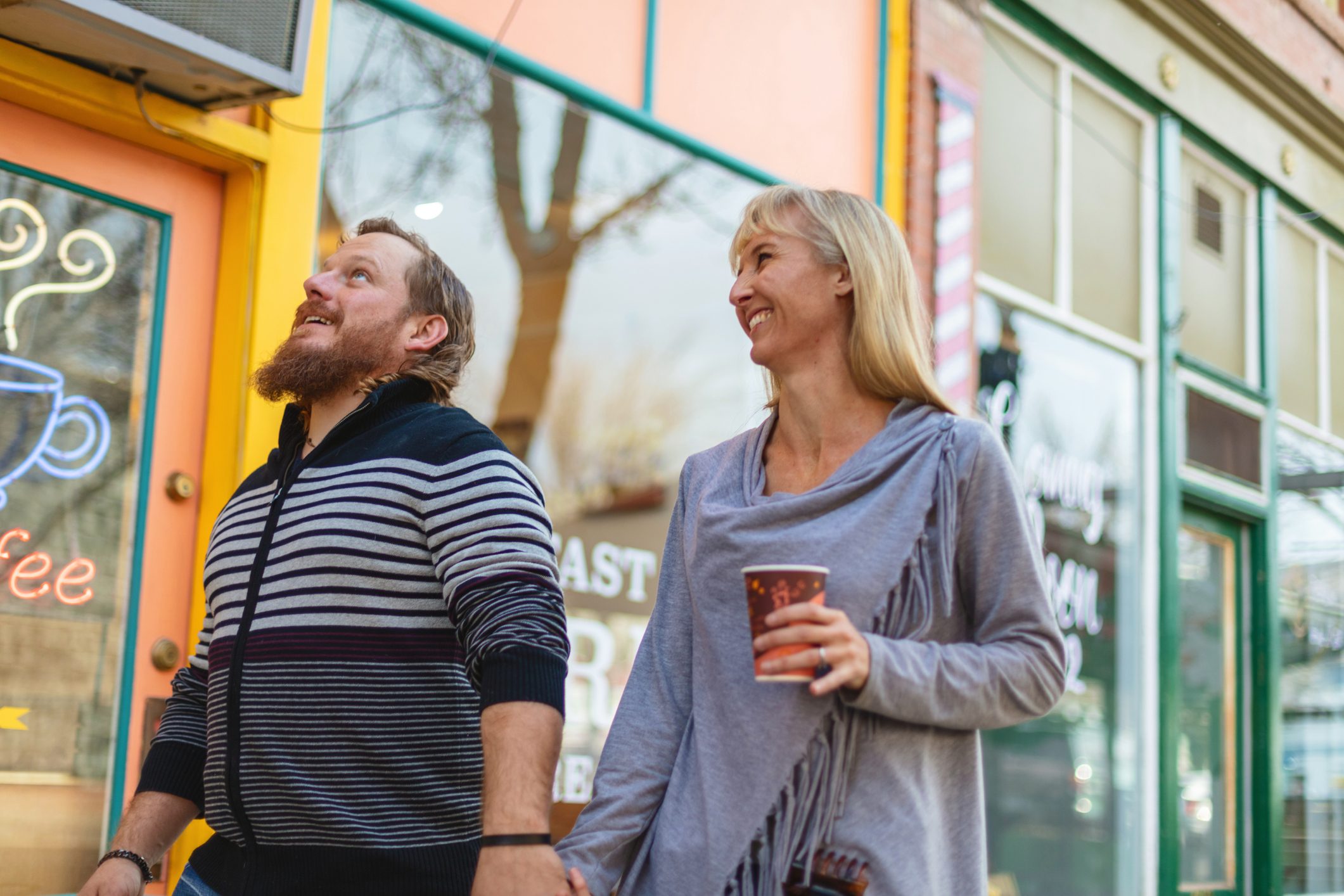 Millennial Couple Outdoors in Small Town America Having Coffee and Pastries Photo Series