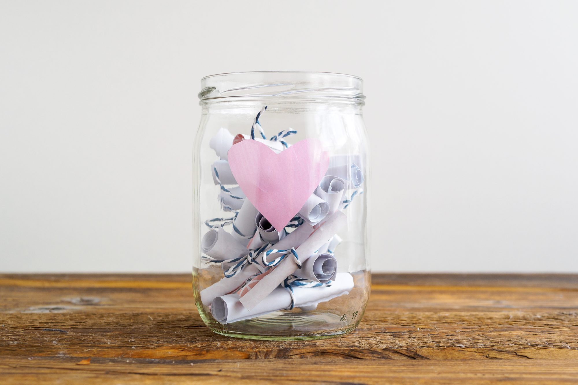 Jar with roas heart and rolled up notes