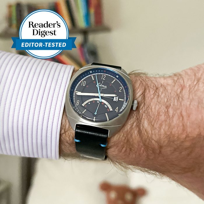 Watch displaying time on a wrist, accompanied by 