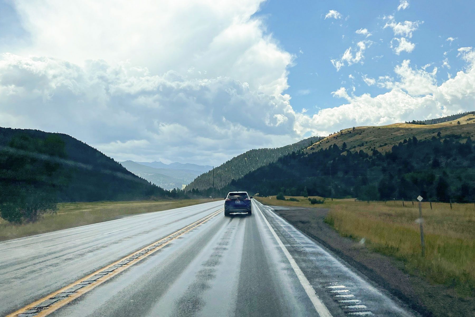 Driving a car with a view of the mountains
