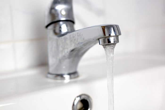 Open the stainless water tap in the bathroom.