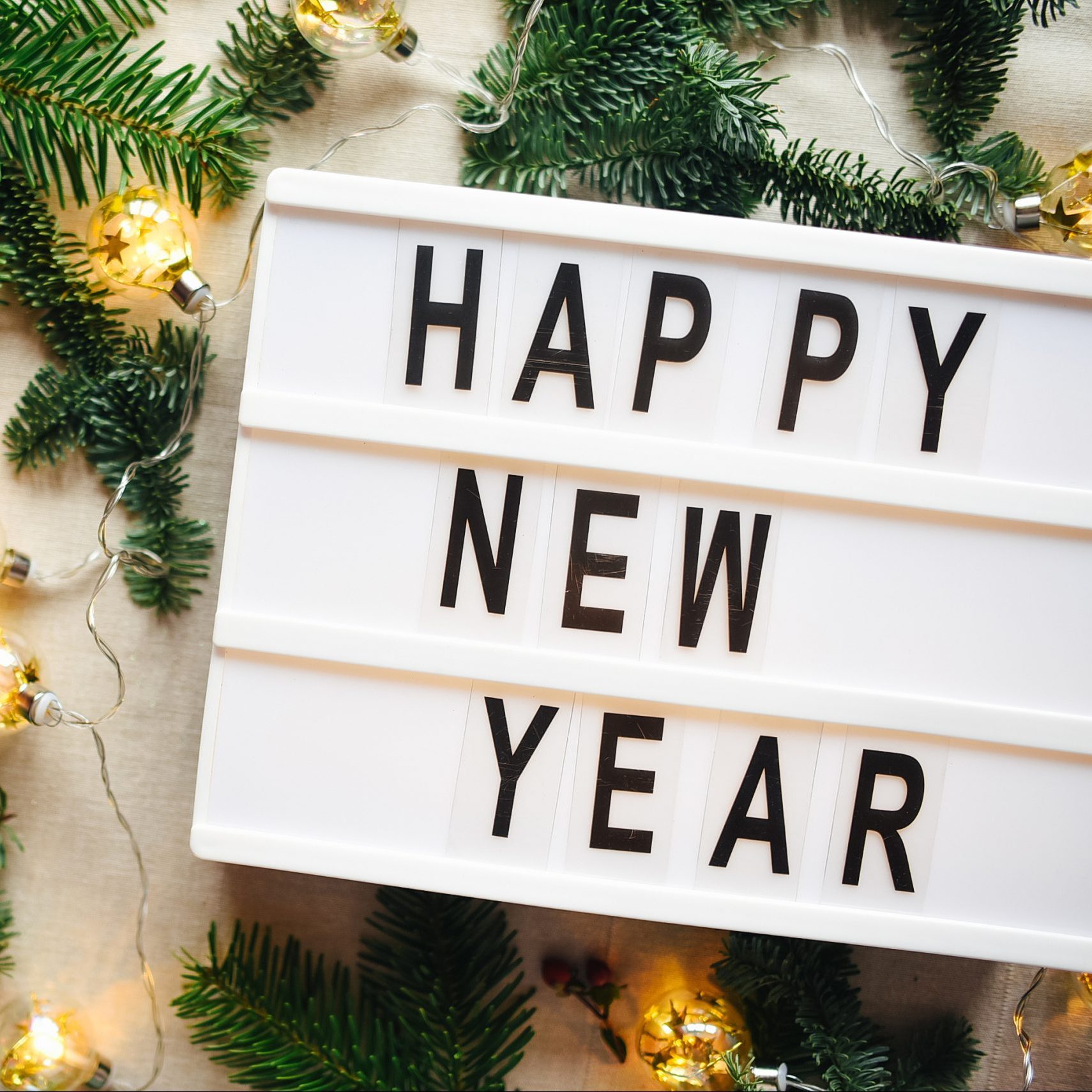 Lightbox with inscription happy new year. Christmas. Festive background.