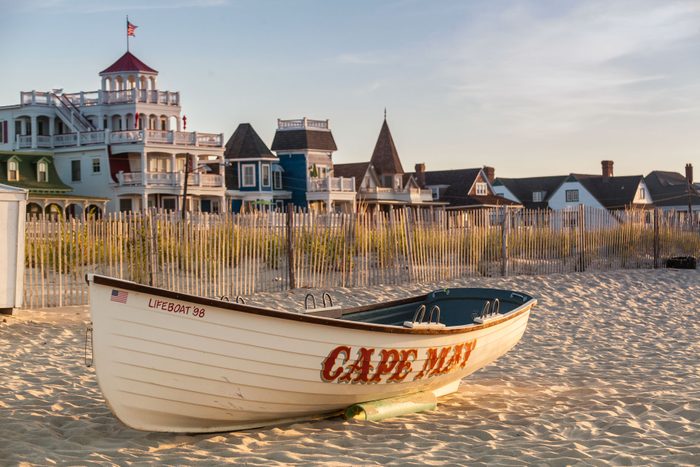 Boat rests on sandy beach, 