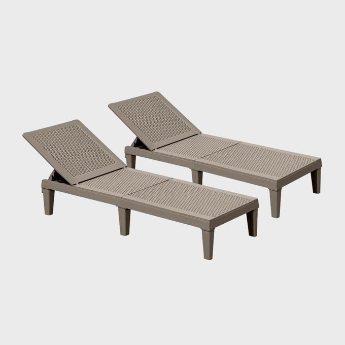 Two beige lounge chairs recline on an empty white background, featuring adjustable backrests and textured surfaces.