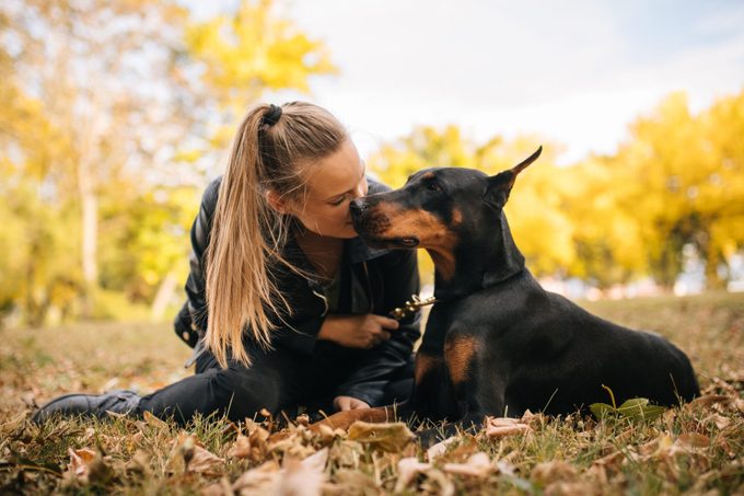 Woman loves her doberman