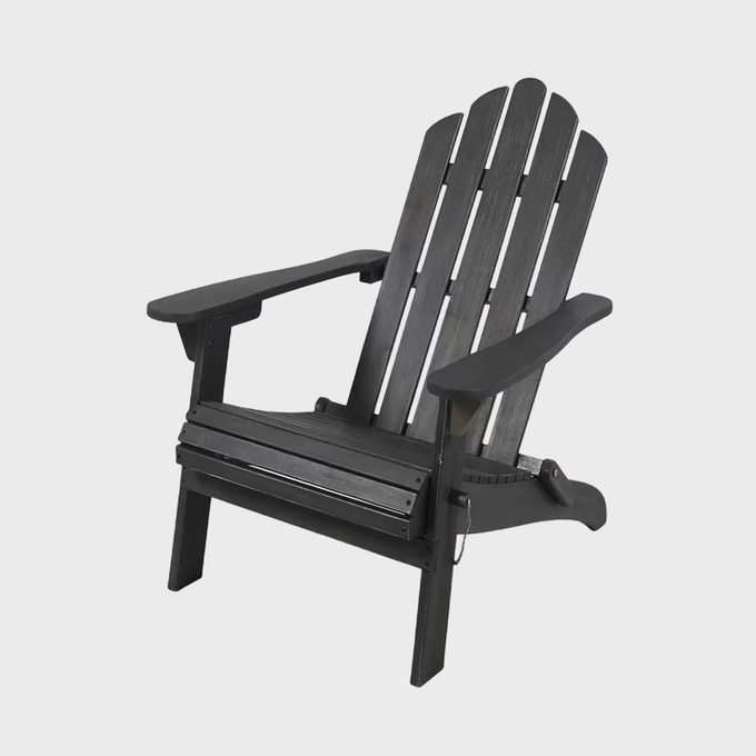 A black Adirondack chair sits empty against a plain white background, showcasing its slatted back and wide armrests.