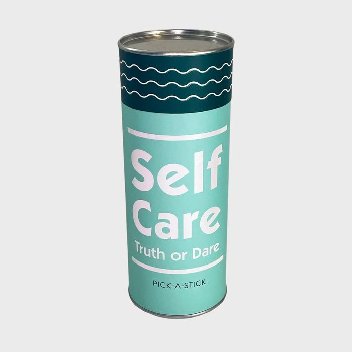 A cylindrical container displays text 