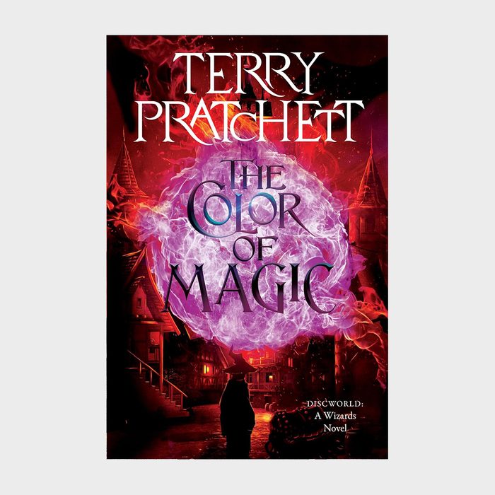 Book cover shows a wizard facing mystical color explosion; background includes buildings. Text: 