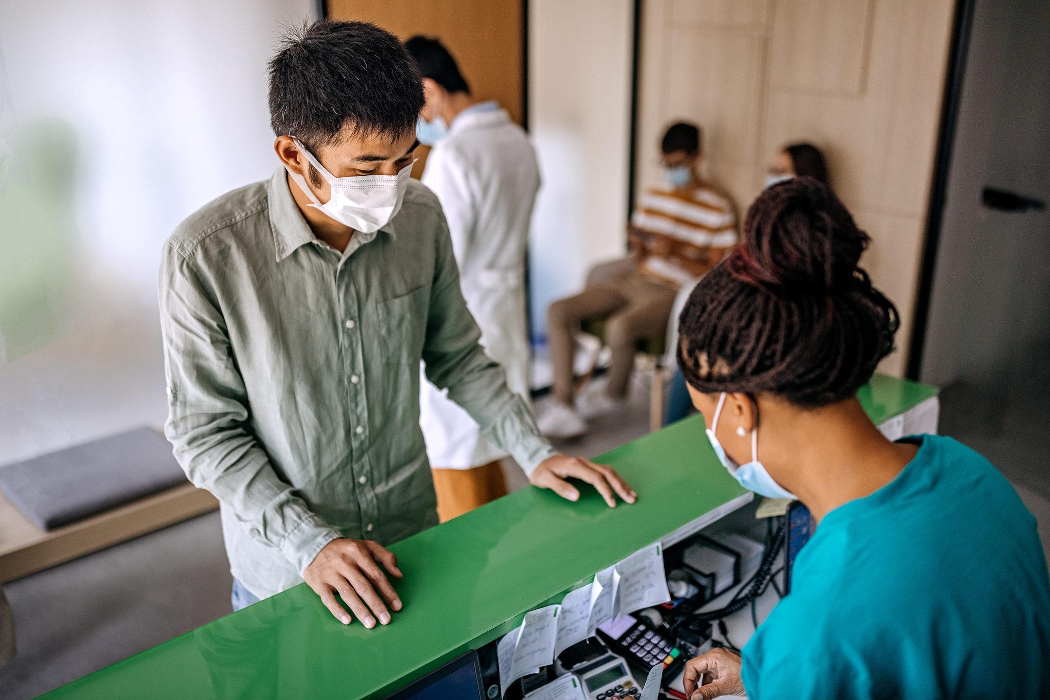 Young man checking in for medical appointment