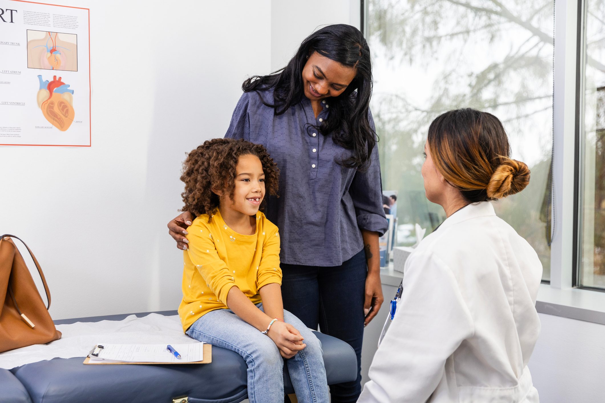 Young female patient sits on the examination table at the doctor's office