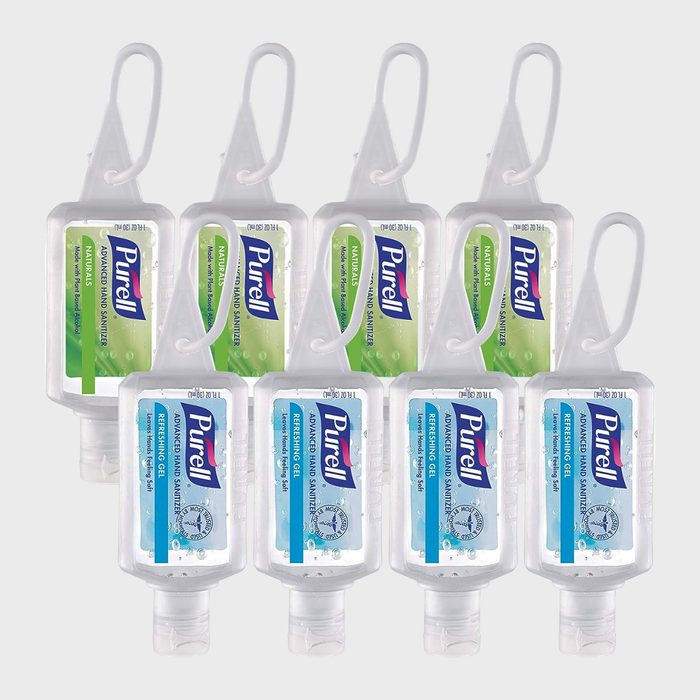 Bottles hang in two rows; each contains Purell hand sanitizer with loop straps, set against a plain backdrop.