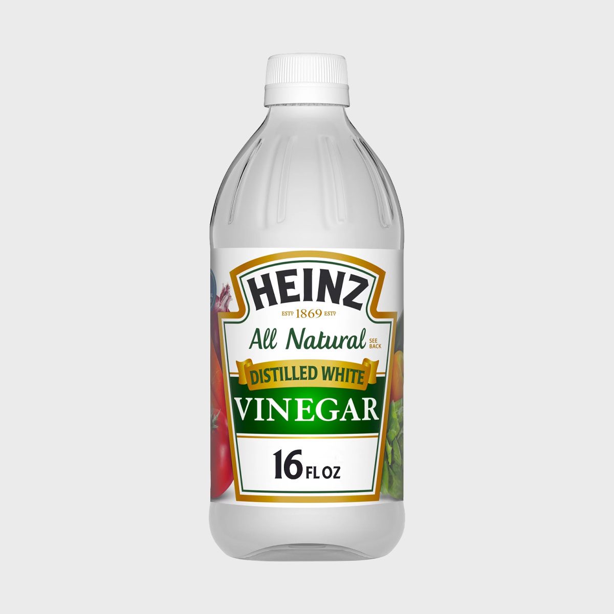 A clear bottle holding distilled white vinegar, labeled "Heinz All Natural," surrounded by illustrations of vegetables. Capacity marked as 16 fl oz.