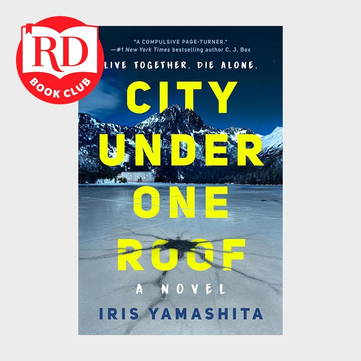 Book cover shows snowy mountains behind a frozen lake, featuring bold yellow text: â€œCITY UNDER ONE ROOFâ€ by Iris Yamashita. Red "RD Book Club" logo present.
