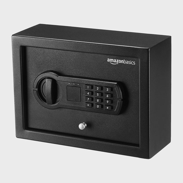 Safe with keypad sits closed; labeled 