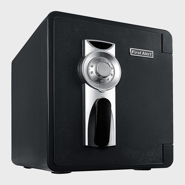 A black safe displays a combination lock and handle, set against a plain background. Text reads 
