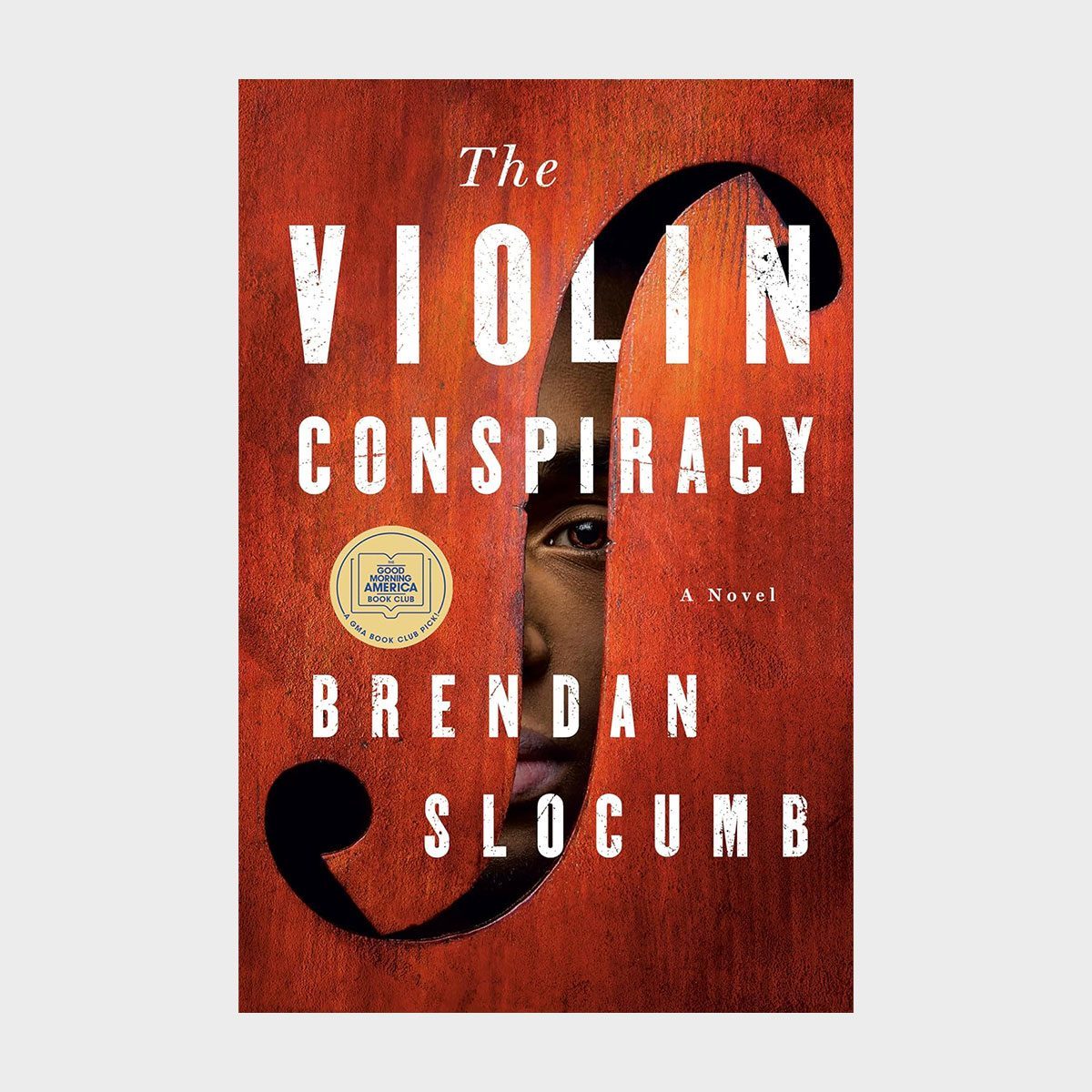 Book cover features text "The Violin Conspiracy," face partially hidden behind violin shape; author's name "Brendan Slocumb" below, with award badge displayed.