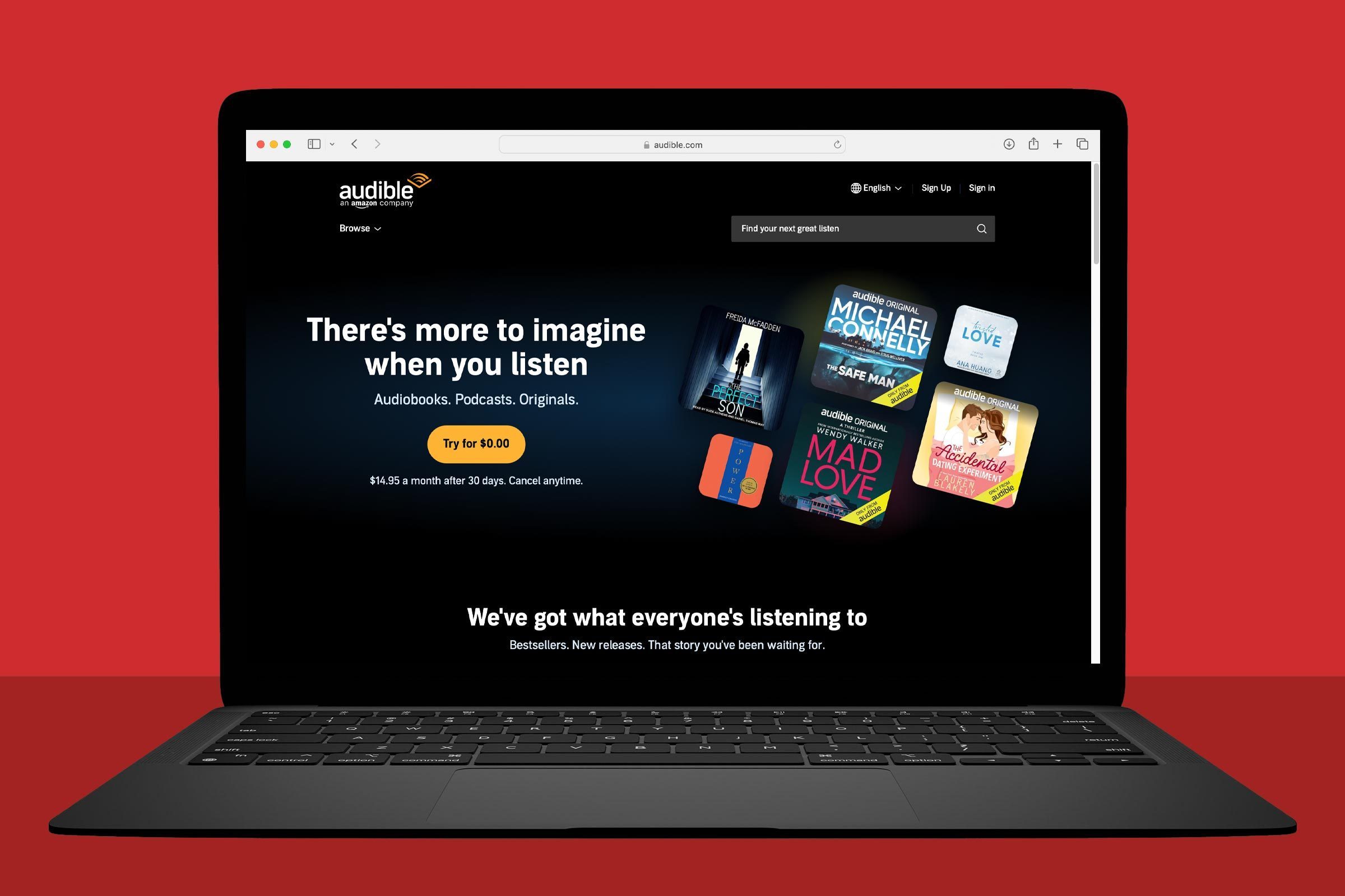 Laptop displaying a website promoting audiobooks, podcasts, and originals with a free trial offer, several book covers, on a red background.