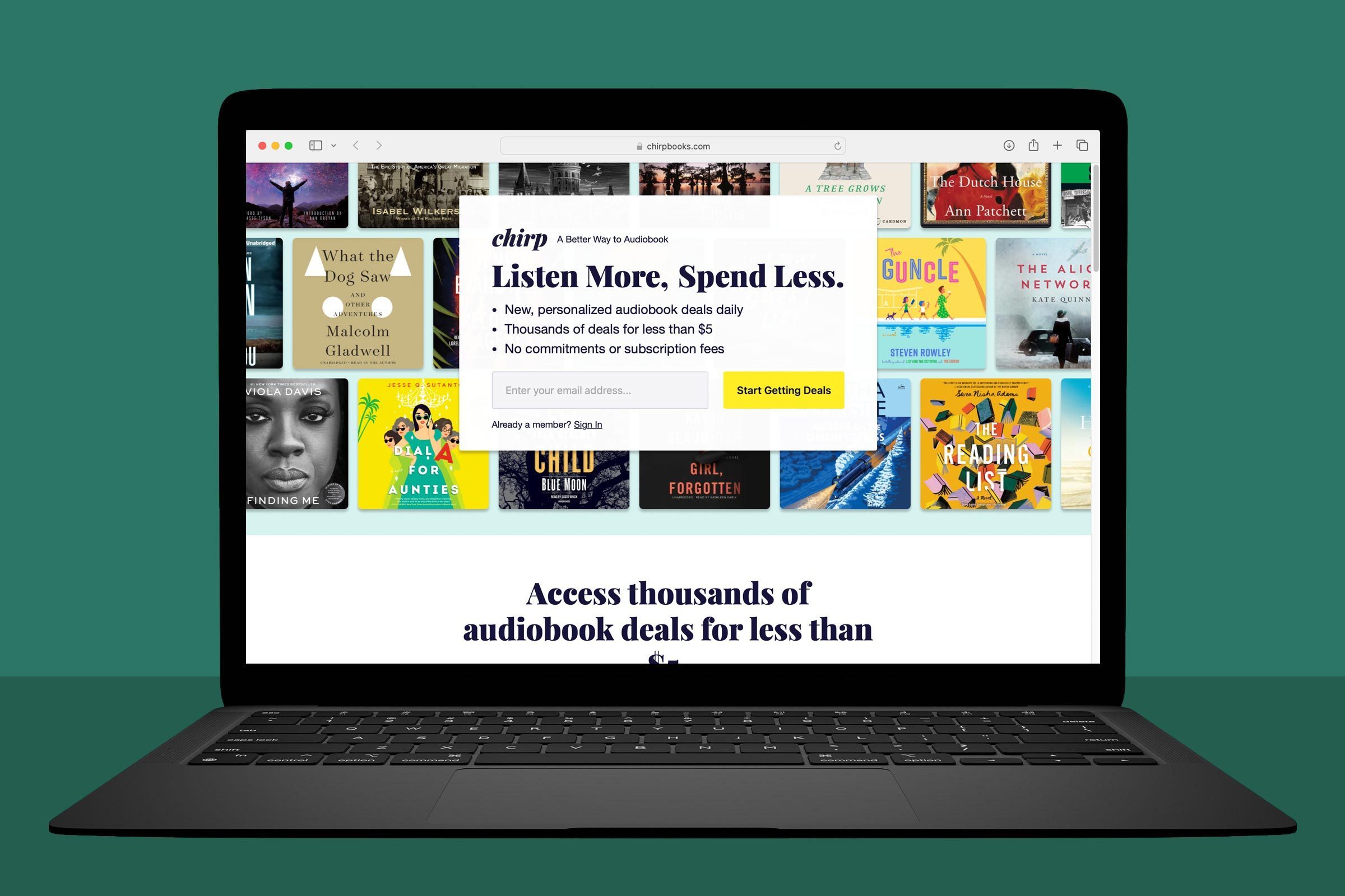 Laptop displaying an audiobook website promoting deals, featuring book covers and text offering personalized daily deals, with no subscription fees.