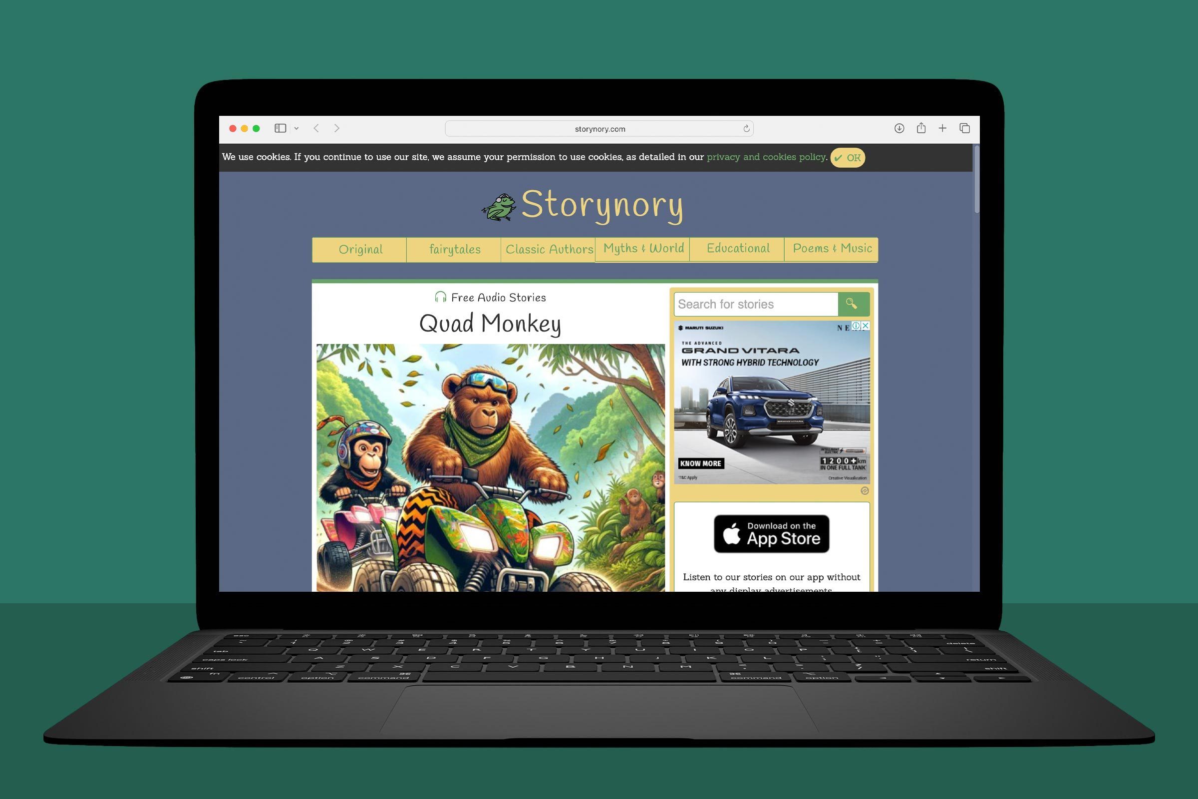 A laptop displays a website featuring "Quad Monkey" story, showing an illustration of two monkeys on quad bikes surrounded by green nature.