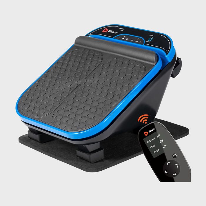 Foot platform vibrates; features a textured surface for grip. Context shows a digital display with settings and a remote control nearby.