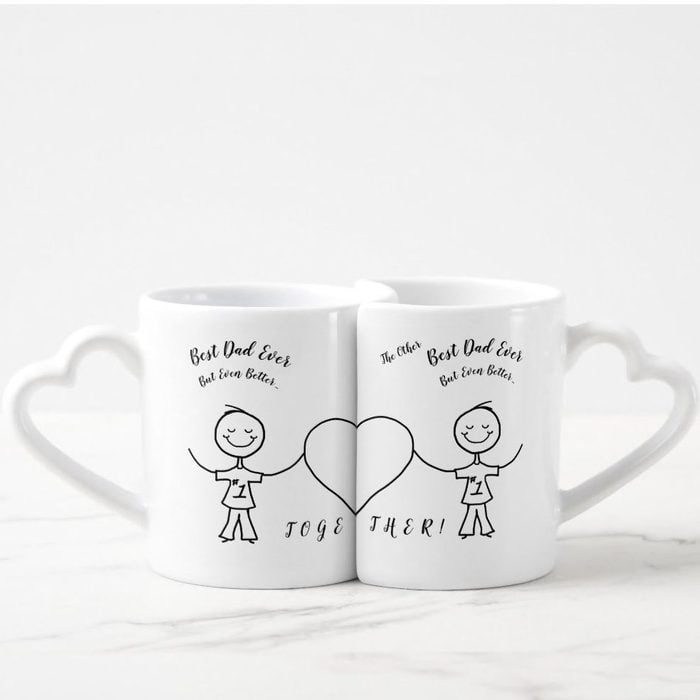 Mugs sit together, forming a heart with linked handles. Each features a happy figure, labeled 