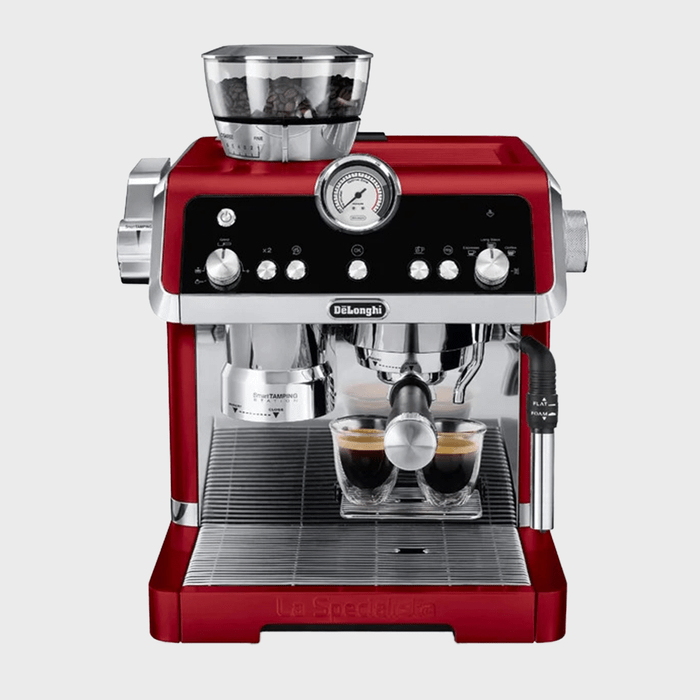 Red espresso machine brewing two cups, surrounded by controls and a bean grinder on top, with a pressure gauge prominently displayed.