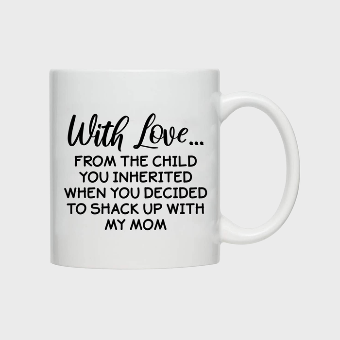 White mug displays humorous black text, saying 