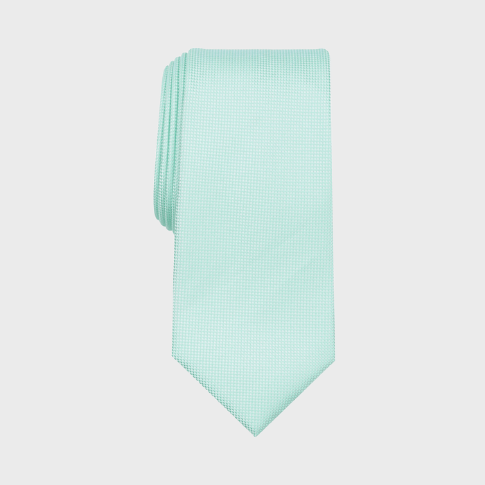 A mint green tie lying flat against a plain white background, showcasing a subtle textured pattern.
