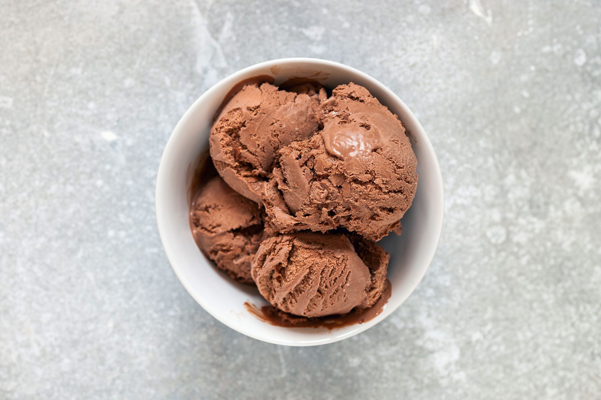 Chocolate Ice Cream In A Bowl On Marble Background