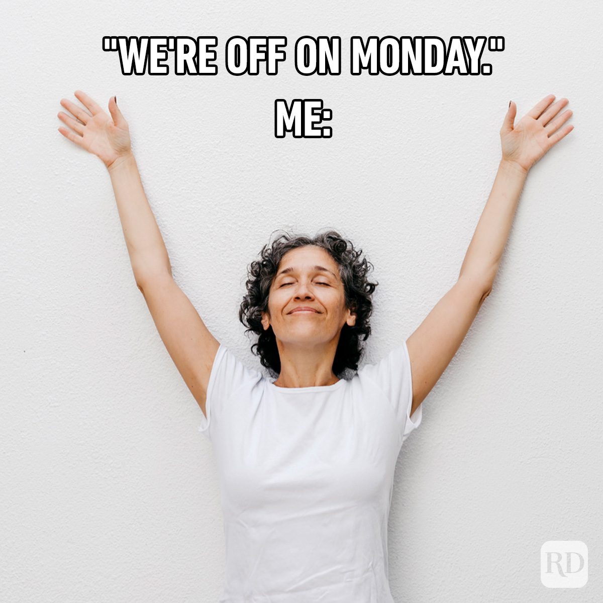 Person smiling, raising arms joyfully against a white wall background. Text reads: "WE'RE OFF ON MONDAY." ME: