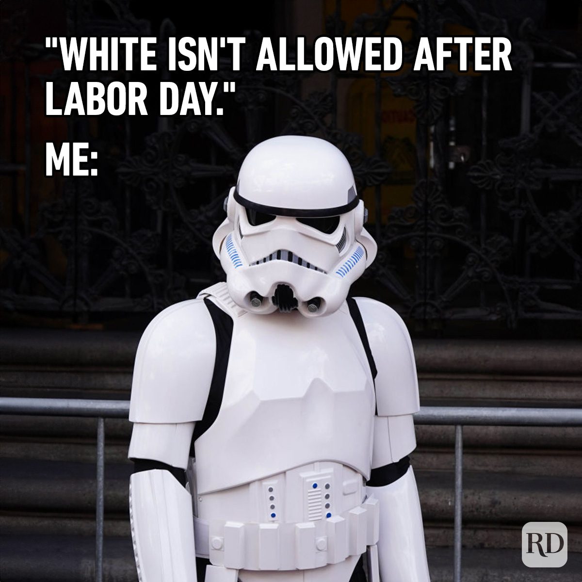 Stormtrooper stands idle in front of ornate gate. Text: "White isn't allowed after Labor Day." Me: