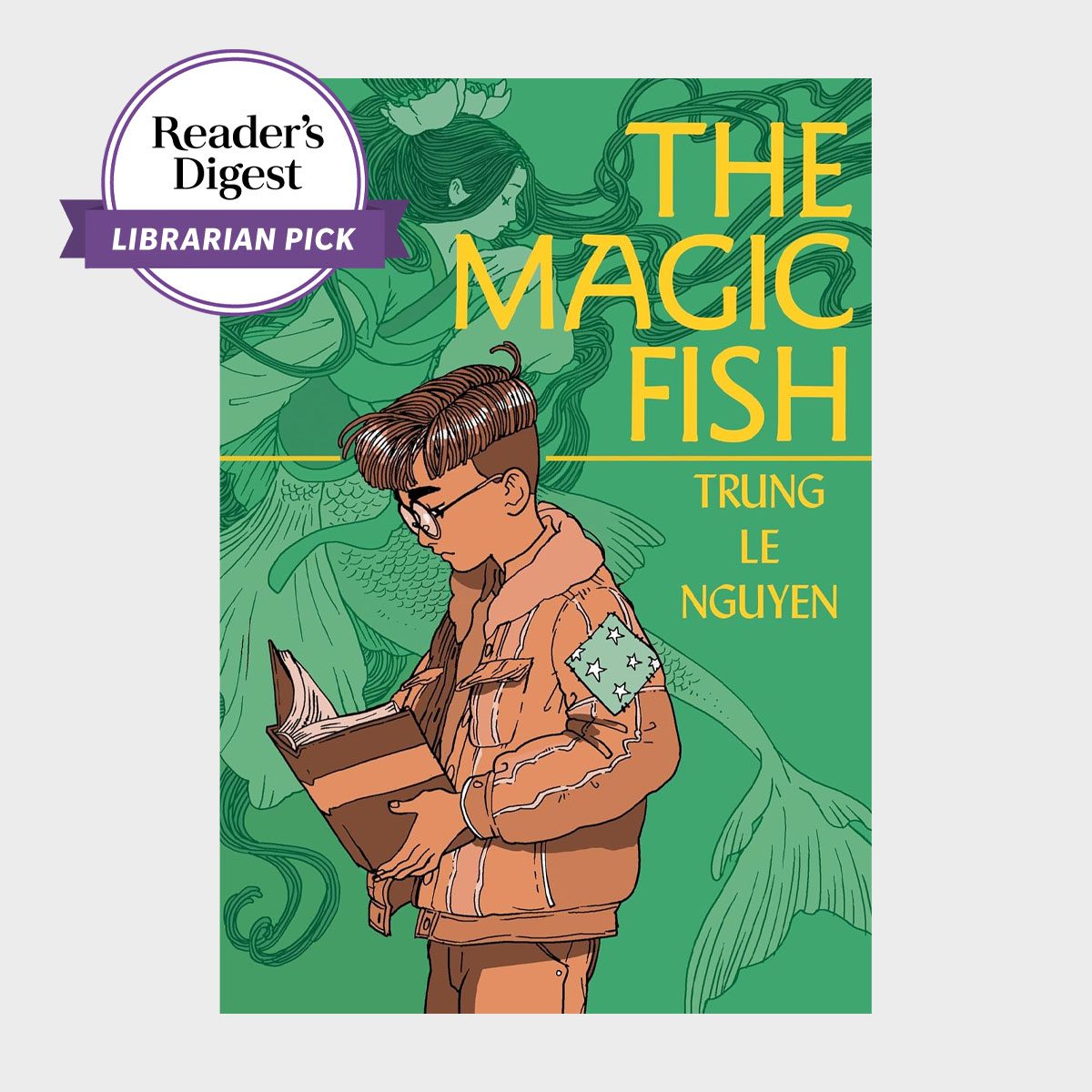 A boy reads a book, surrounded by underwater illustrations, with text: "THE MAGIC FISH" and "TRUNG LE NGUYEN" on a green background.