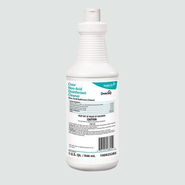 A white bottle contains Crew Non-Acid Disinfectant Cleaner, displaying details and a barcode, sitting against a pale gray background.