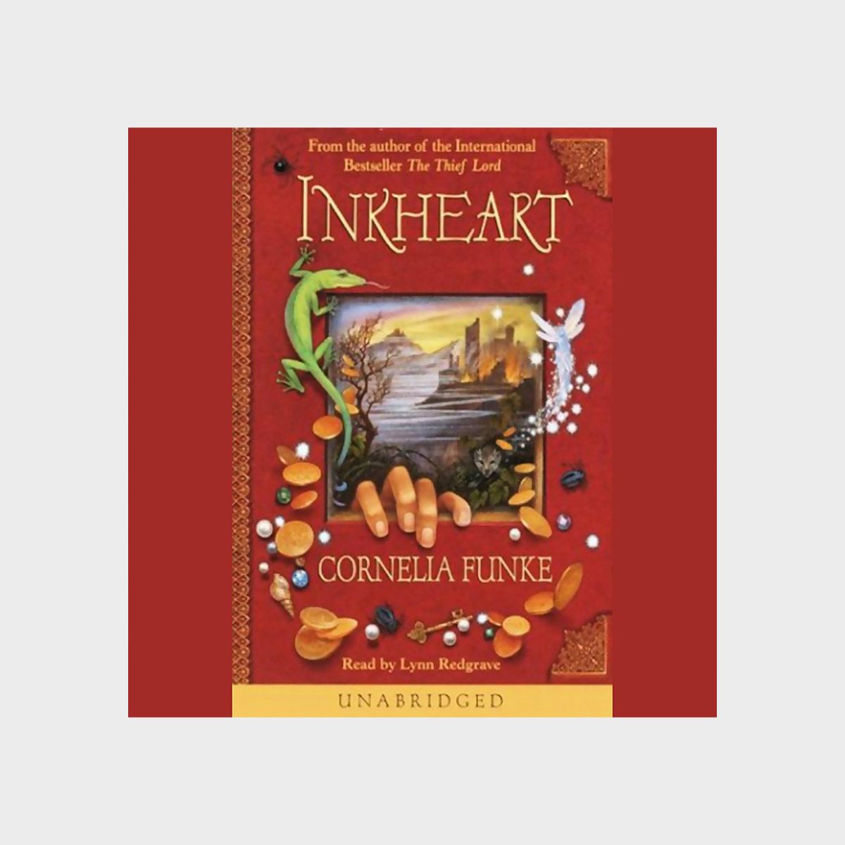 Book cover shows "Inkheart" by Cornelia Funke; features a green lizard, fairy, coins, and hand emerging from a forest scene, surrounded by a red border.