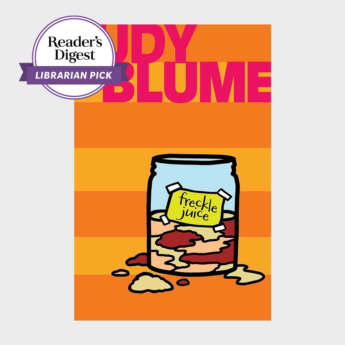 A jar labeled "freckle juice" spills its colorful contents on a vibrant orange-striped background. Text reads "Judy Blume" and "Reader's Digest Librarian Pick."