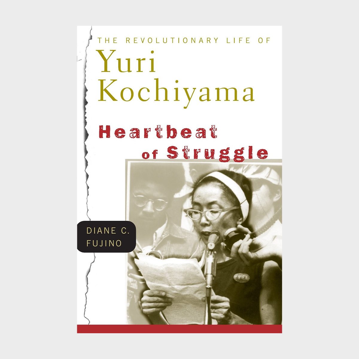 Book cover shows a woman reading at a microphone, surrounded by people. Title: "The Revolutionary Life of Yuri Kochiyama: Heartbeat of Struggle" by Diane C. Fujino.