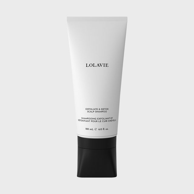 White squeeze tube stands upright, labeled 