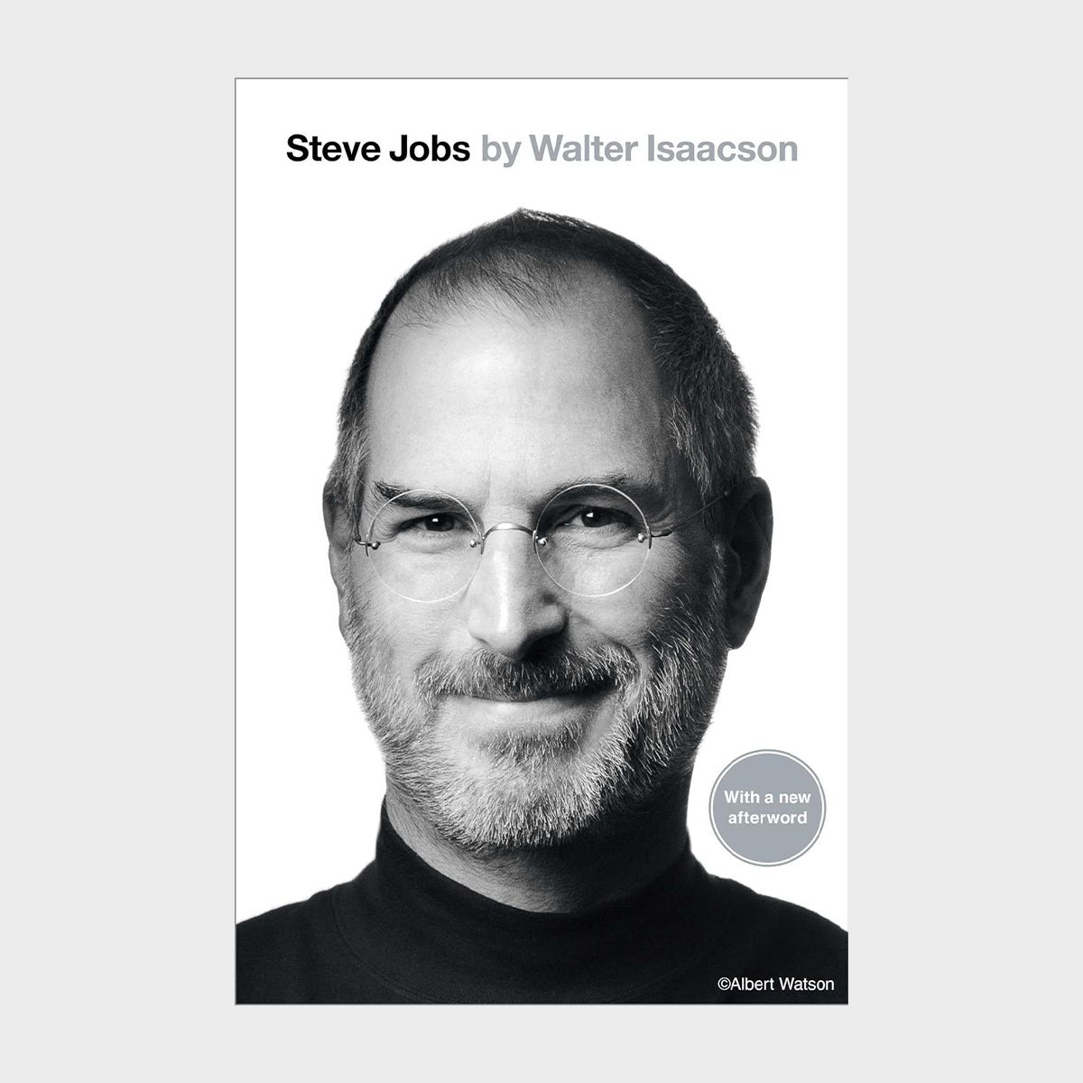 Man smiling, wearing glasses and a turtleneck, centered against a plain background. Text: "Steve Jobs by Walter Isaacson", "With a new afterword".