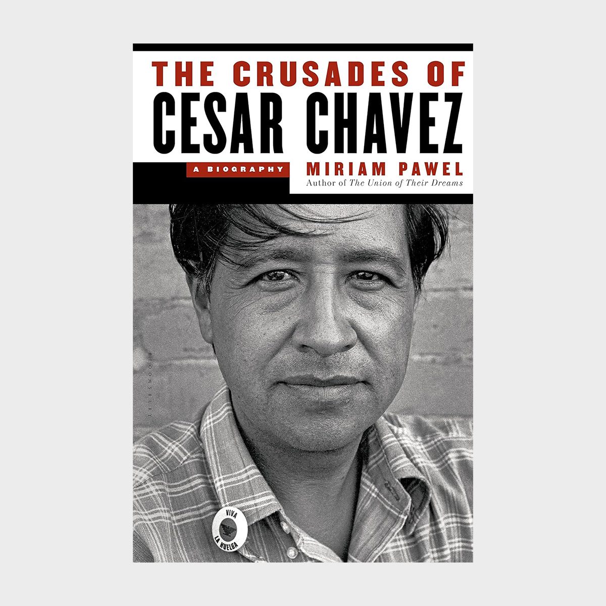 Book cover shows a grayscale portrait of a man, wearing a plaid shirt with a button saying "Viva La Huelga." Title: â€œThe Crusades of Cesar Chavez.â€