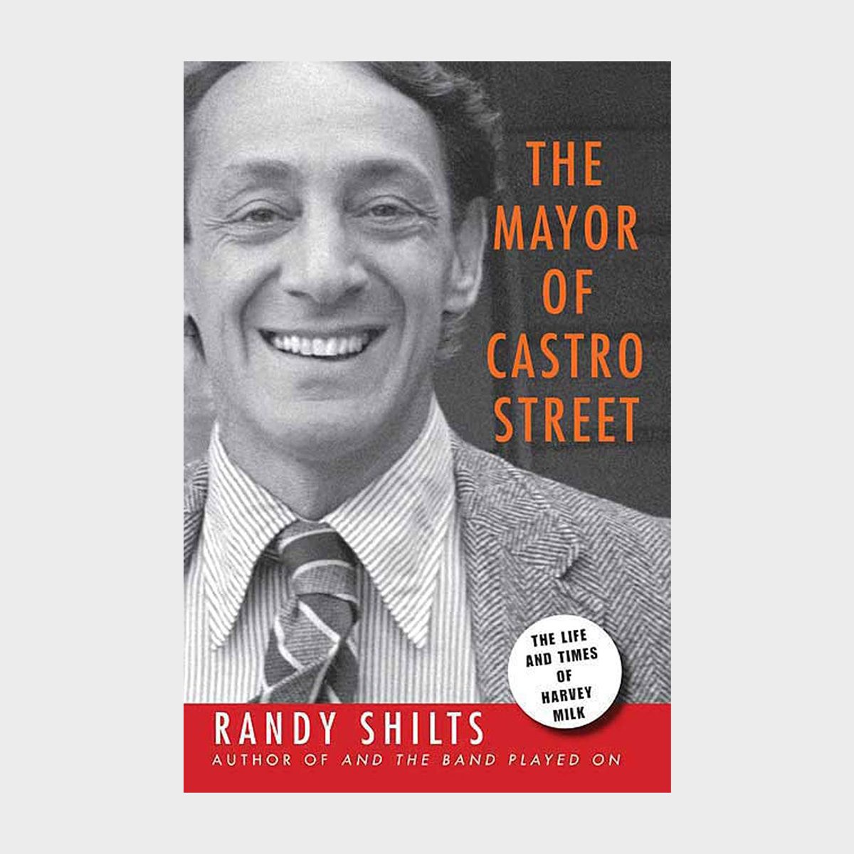 A smiling man is on the book cover titled "The Mayor of Castro Street" by Randy Shilts, with a subtitle about Harvey Milk's life.