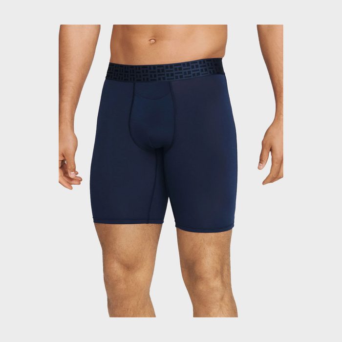 Navy blue boxer briefs being worn, standing against a neutral background.