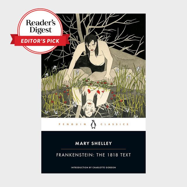 Person crouches by pond, reflecting on water. Surrounded by bare trees and flowers. Text: 