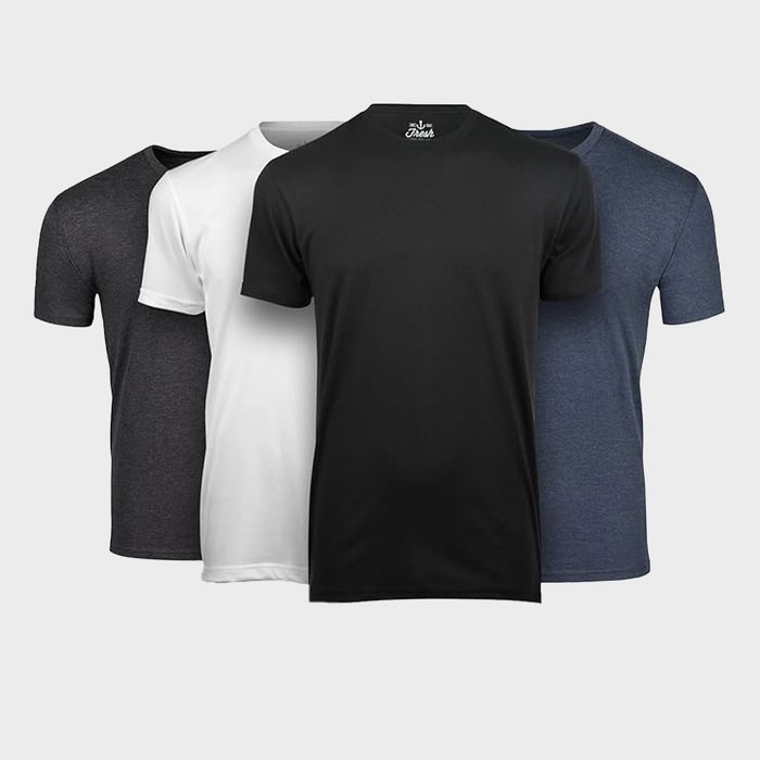 Four t-shirts, colored black, white, gray, and dark blue, are arranged side-by-side. The background is plain and light gray.