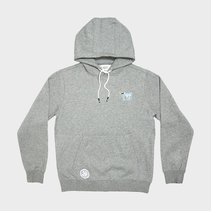 Gray hoodie displayed flat, features a small embroidered blue goat on the chest. White drawstring, large front pocket, beige background.