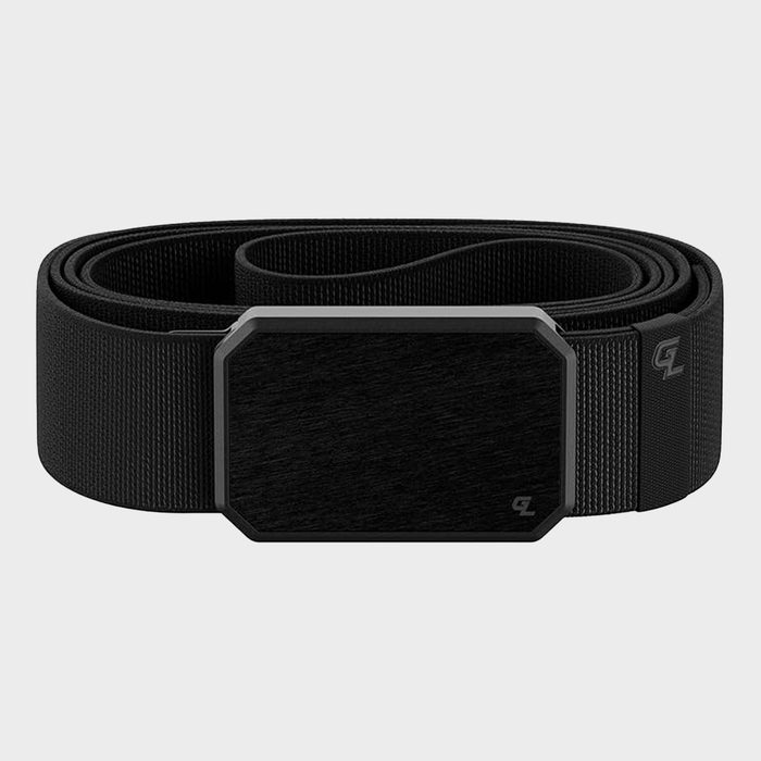 A black belt with a rectangular buckle lies coiled against a plain gray background. Small logo printed on the fabric.